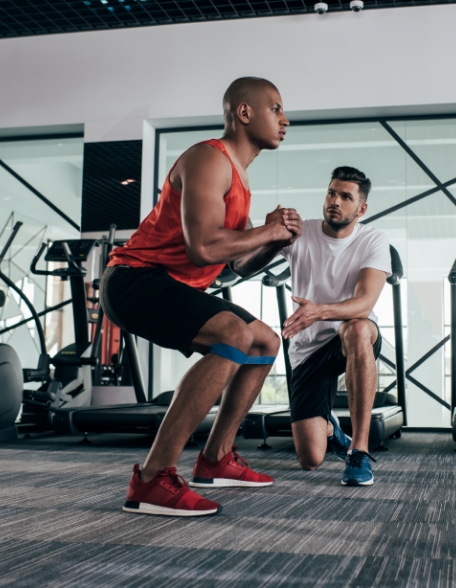 athletic trainer helping client