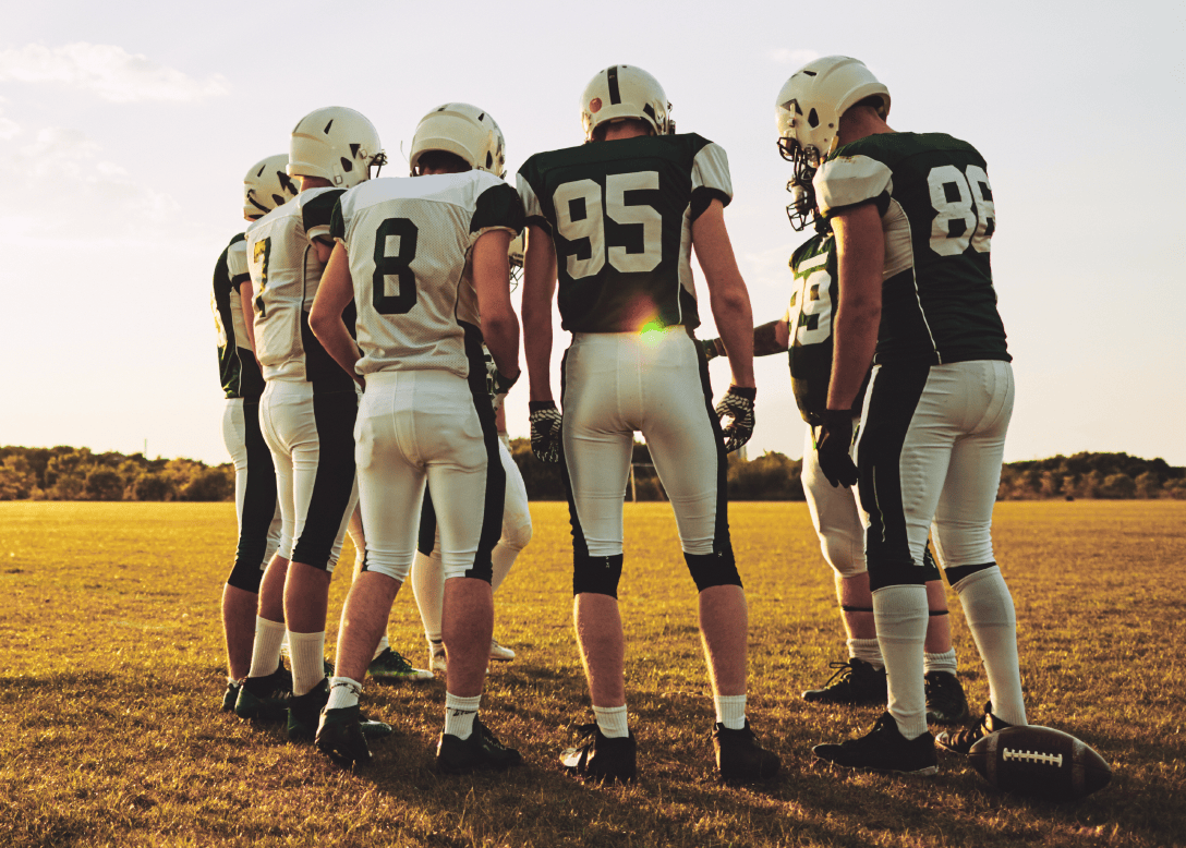 football players huddling